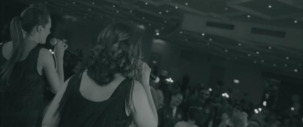 Two female performers on stage during our movie tribute show